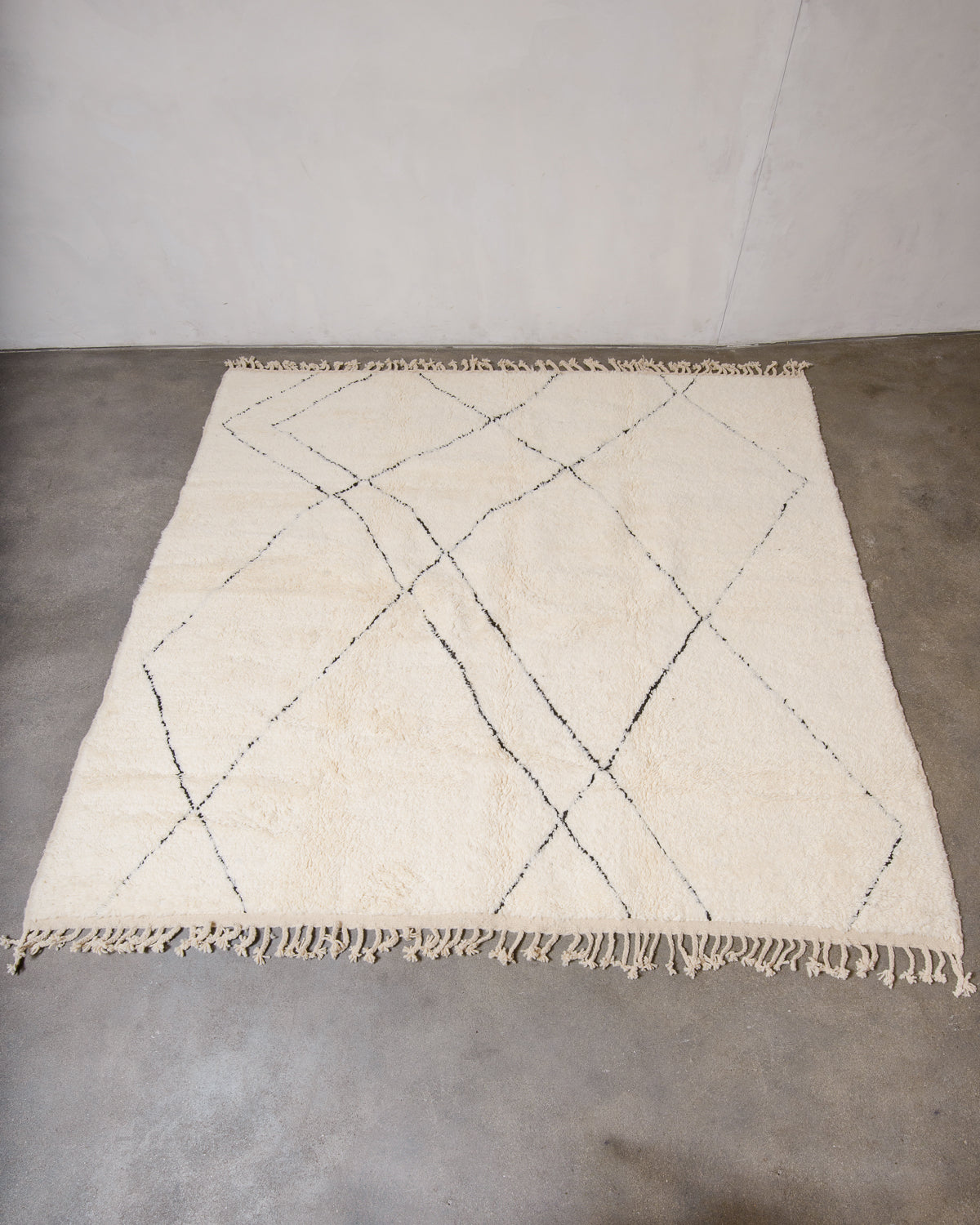 Modern, designer, handcrafted Berber rug from Morocco. Beniourain carpet with minimalist design, natural wool pile and a fluffy texture.
